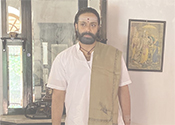 Aditya Om as Temple Priest In Dahnam